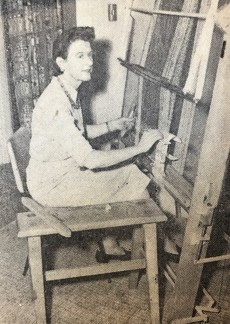 Mildred Fischer sitting at a loom