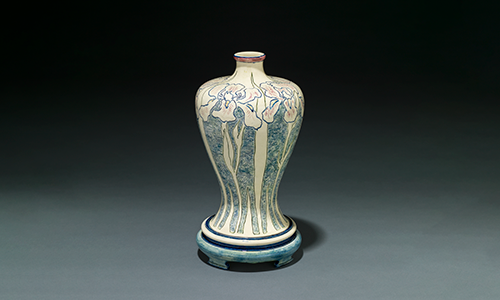 A tall vessel with flower decorations