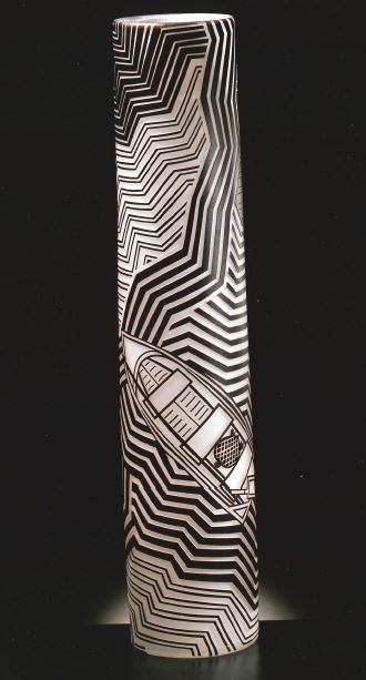 An intricately decorated glass cylinder in black and white, featuring a boat and angular waves