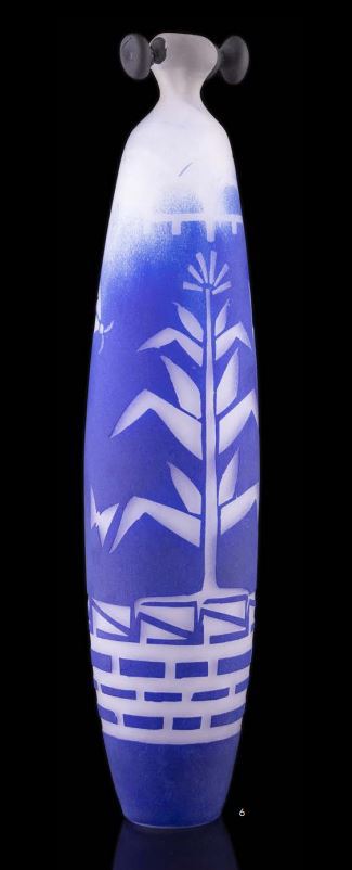 Blue Corn Maiden is a blown, cut, and sand-blasted vessel. This work is a tall cylindrical form.