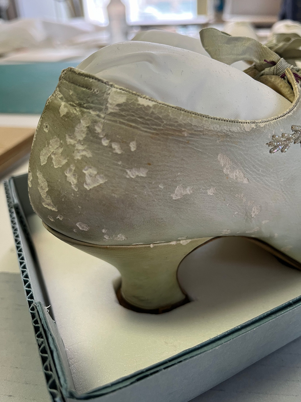 The heel of the right shoe has the worst—and most textbook—damage from silverfish grazing. You can see how the insect has sort of rasped away the surface of the leather as it wandered over the surface. 