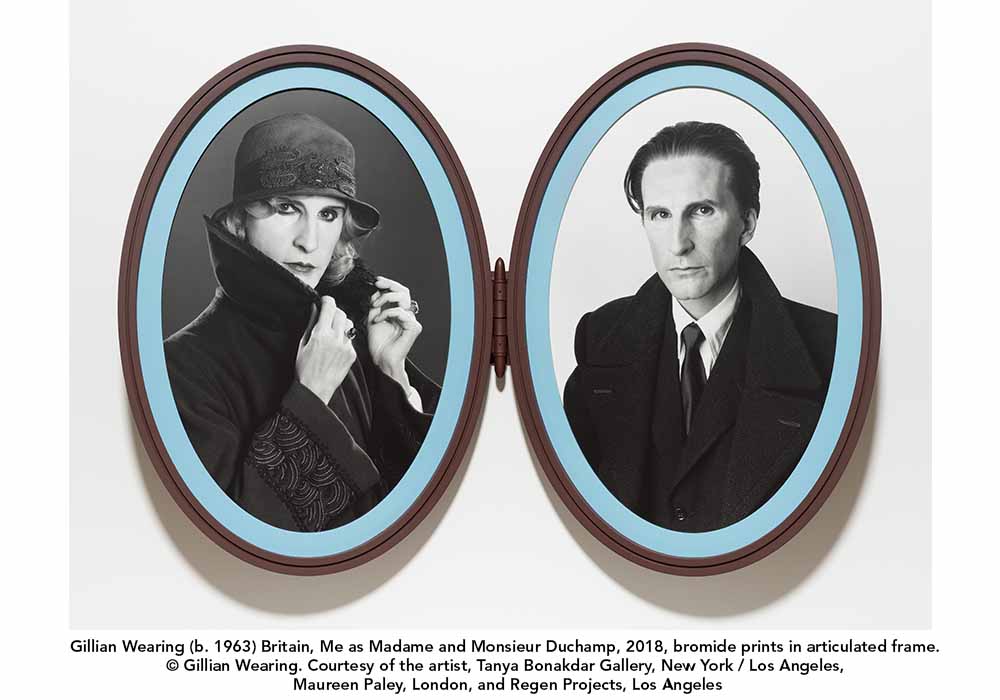 An oval shaped locket with two black and white pictures of Gillian Wearing, one in women's clothes and makeup as Madame Duchamp, the other in a suit and jacket and Monsieur Duchamp