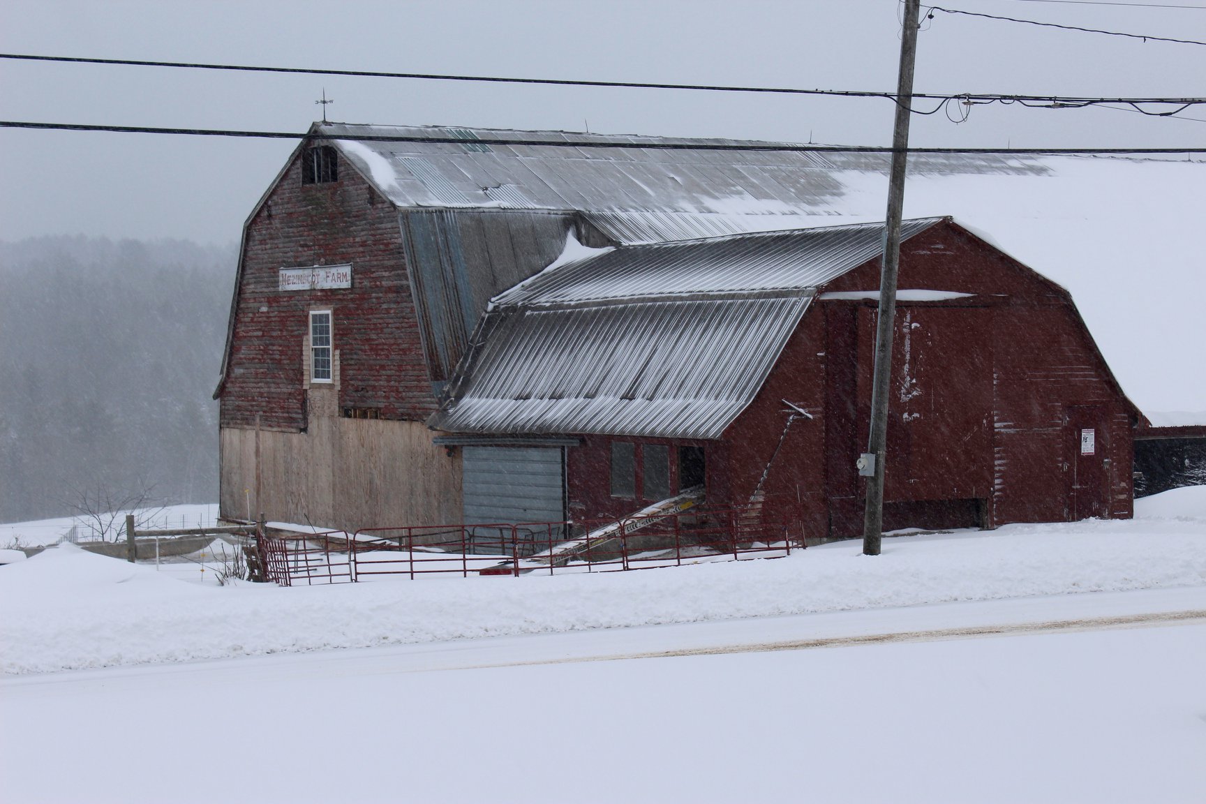 barn covered in snow