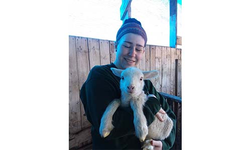 Samantha holding a lamb