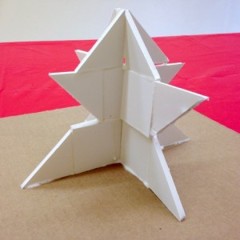 a statue made of foam squares and triangles