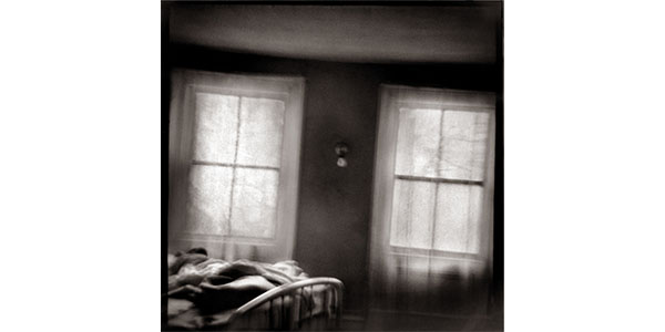 Nancy Rexroth's Two Windows, a black and white photograph of two windows in a bedroom