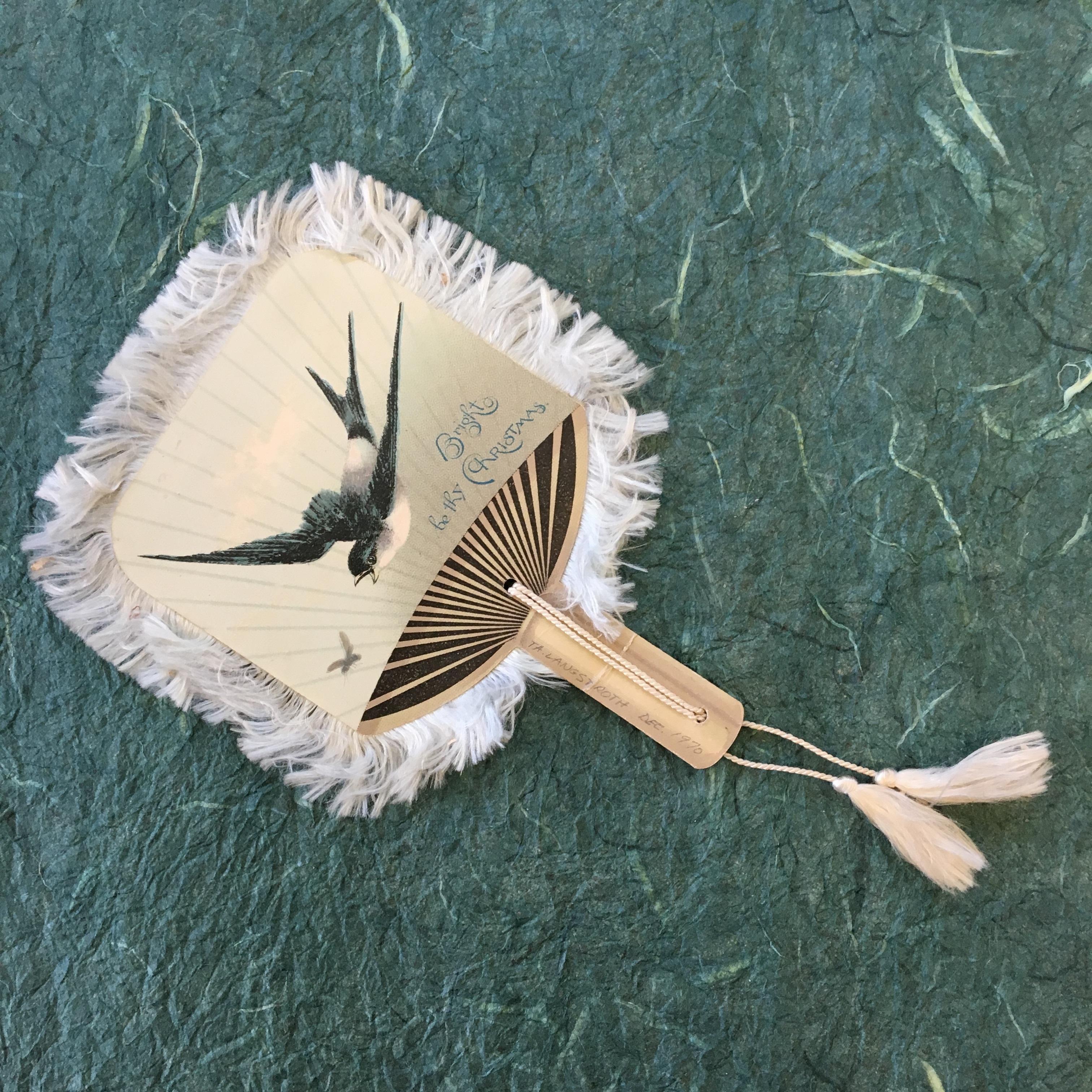hand fan with an image of a swallow