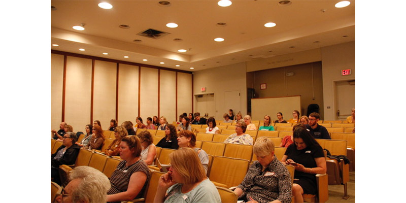 Teachers attending a presentation in the Fath Auditorium