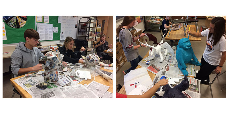 students working on paper mache projects