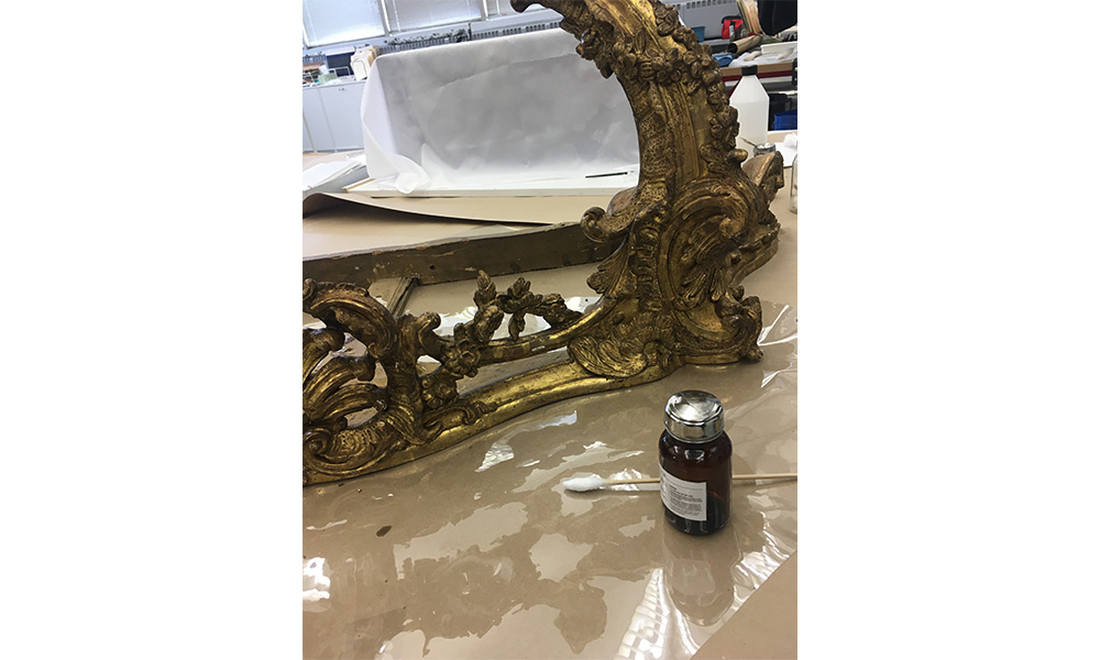 cleaning a gold gilded table 