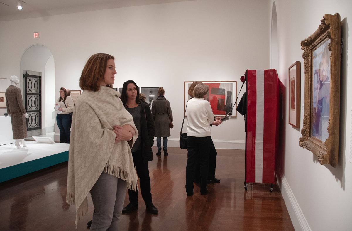 Visitors admire various works in an exhibition