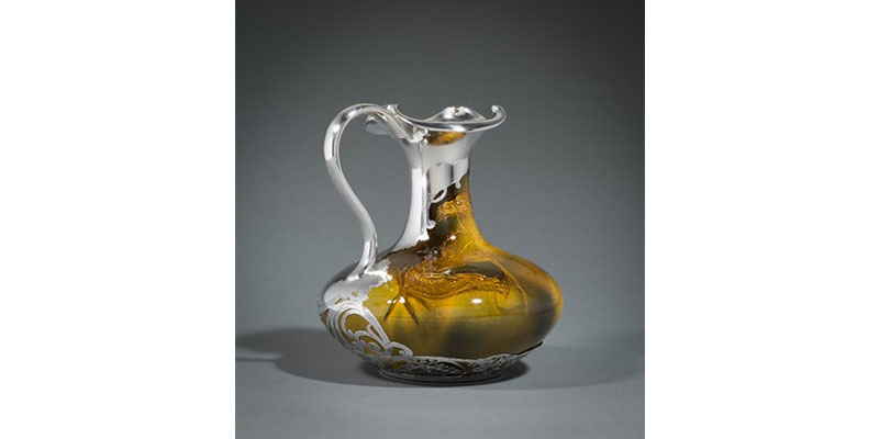ornate ceramic jug with handle
