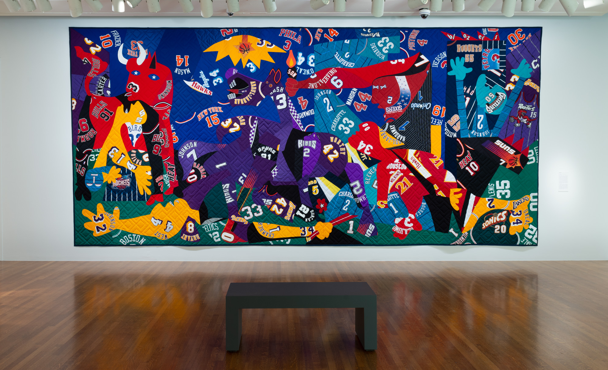 Hank Willis Thomas' Guernica, a remake of the Pablo Picasso painting of the same name, using various sports jerseys cut into the forms and shapes, and fashioned into a quilt