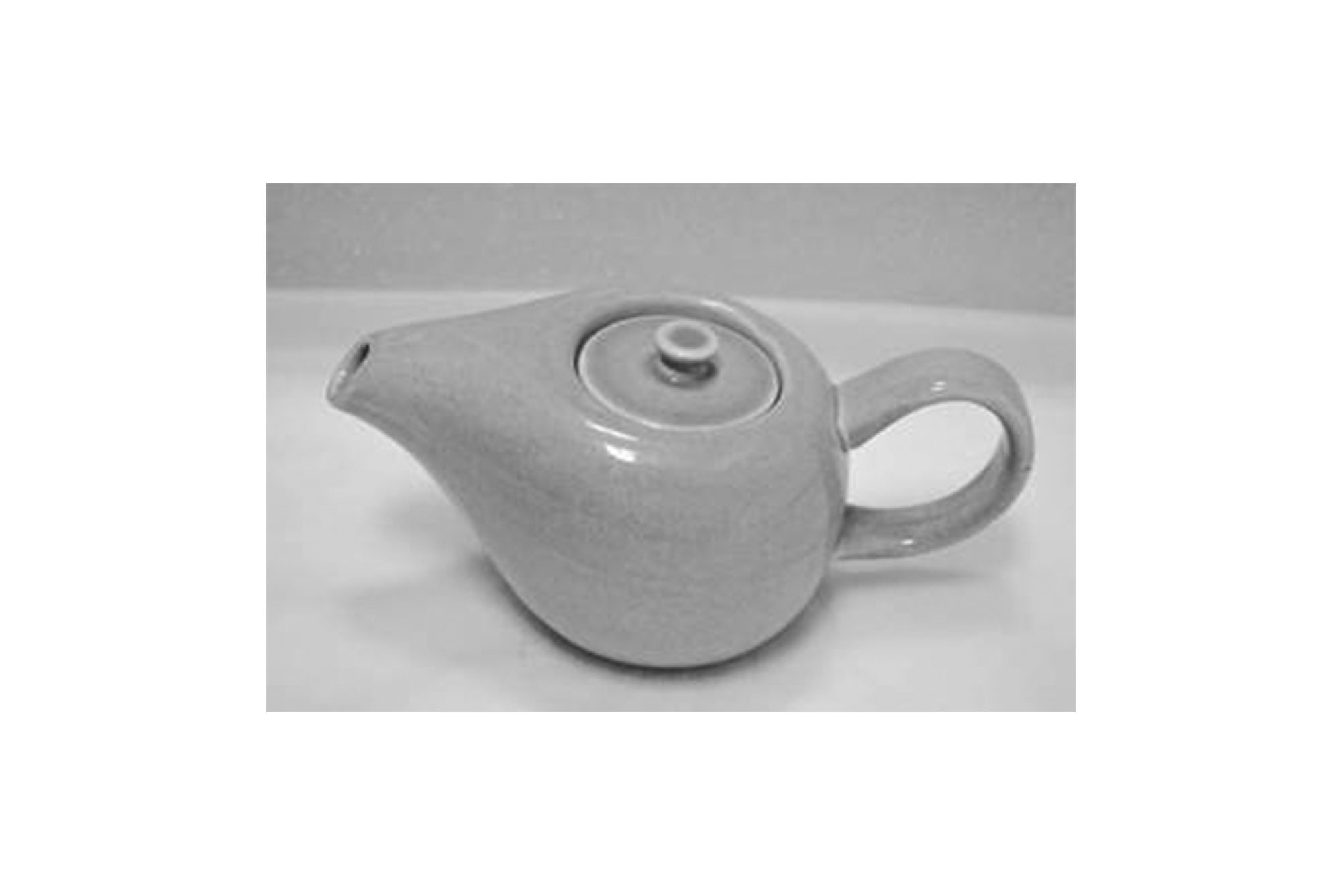 Russel Wright's After Dinner Coffee Pot, a small glazed  pot with a handle and short spout