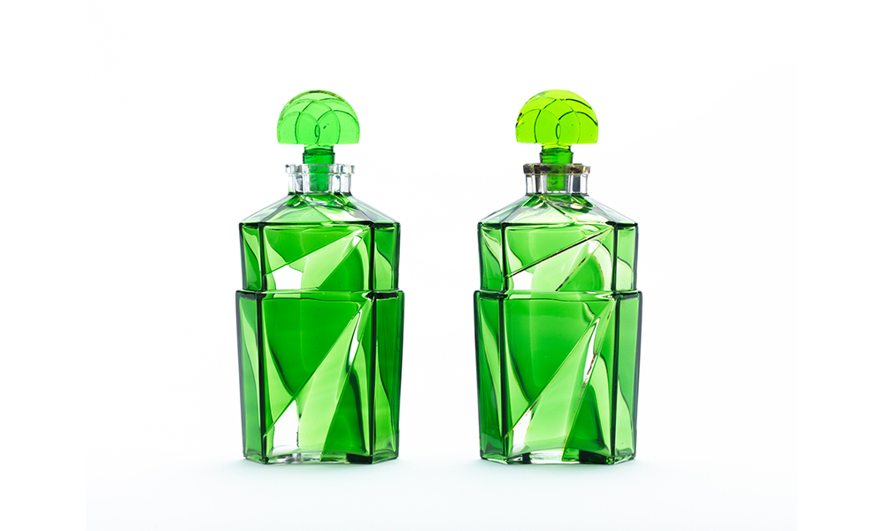 Two green, glass perfume bottles 