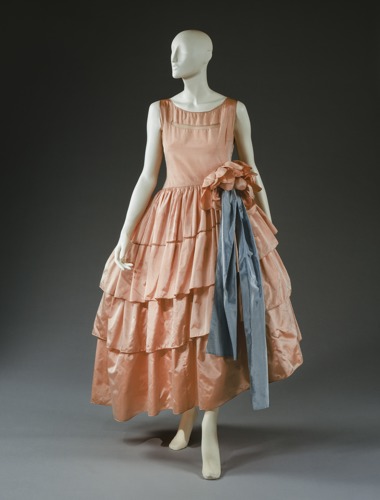 peach colored dress with blue ribbon