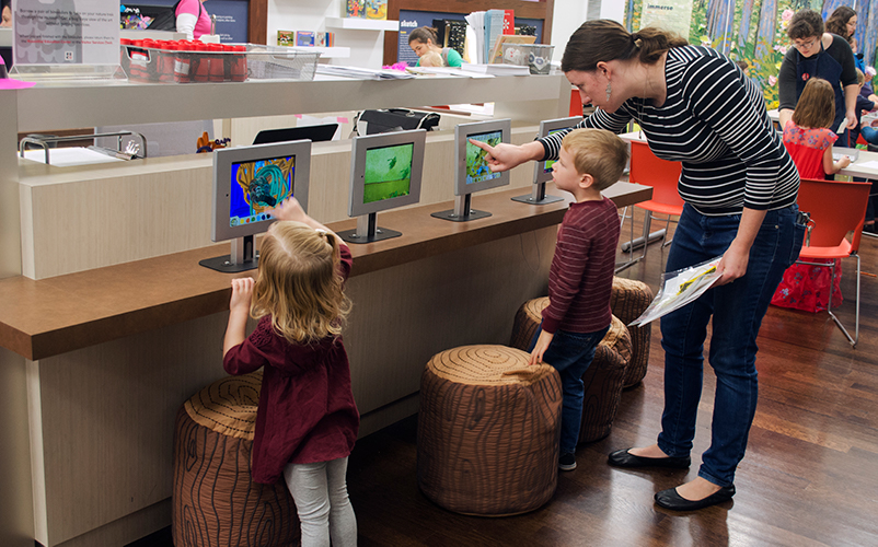 Children viewing interactives in the Rosenthal Education Center