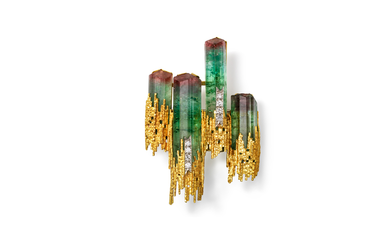 Andrew Grima's Brooch, green, cylindrical cut, gemstones with red tops, encased in gold and diamonds at the bottom