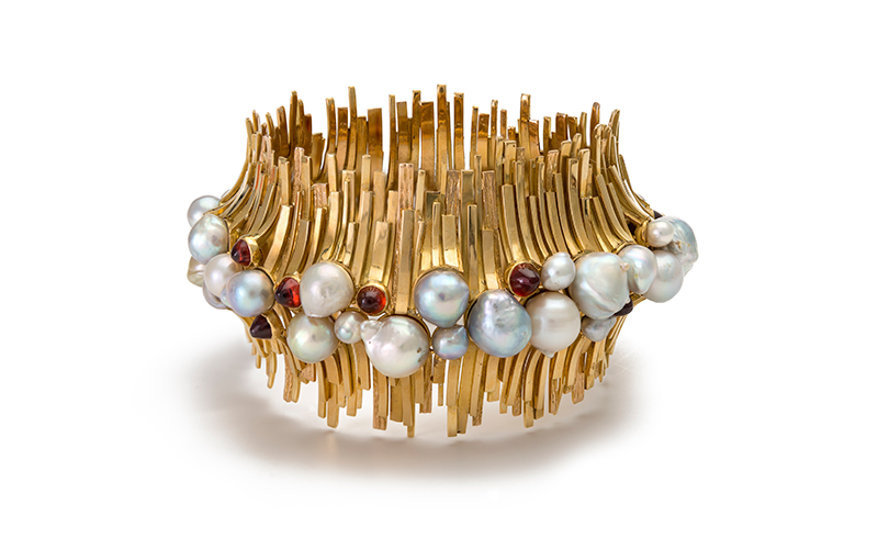 David Thomas' Bracelet, featuring pearls, garnets in an array of uneven and slender stacked strips of gold.