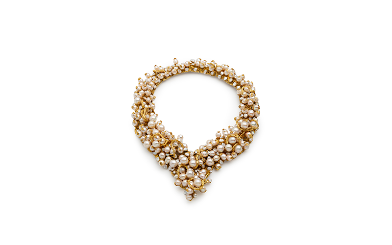 Barbara Anton's Potpourri of Pearls Necklace, a round and thick necklace featuring many diverse pearls in gold, and studded with diamonds.