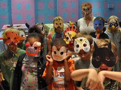 children wearing the masks they made during Summer ARTventure