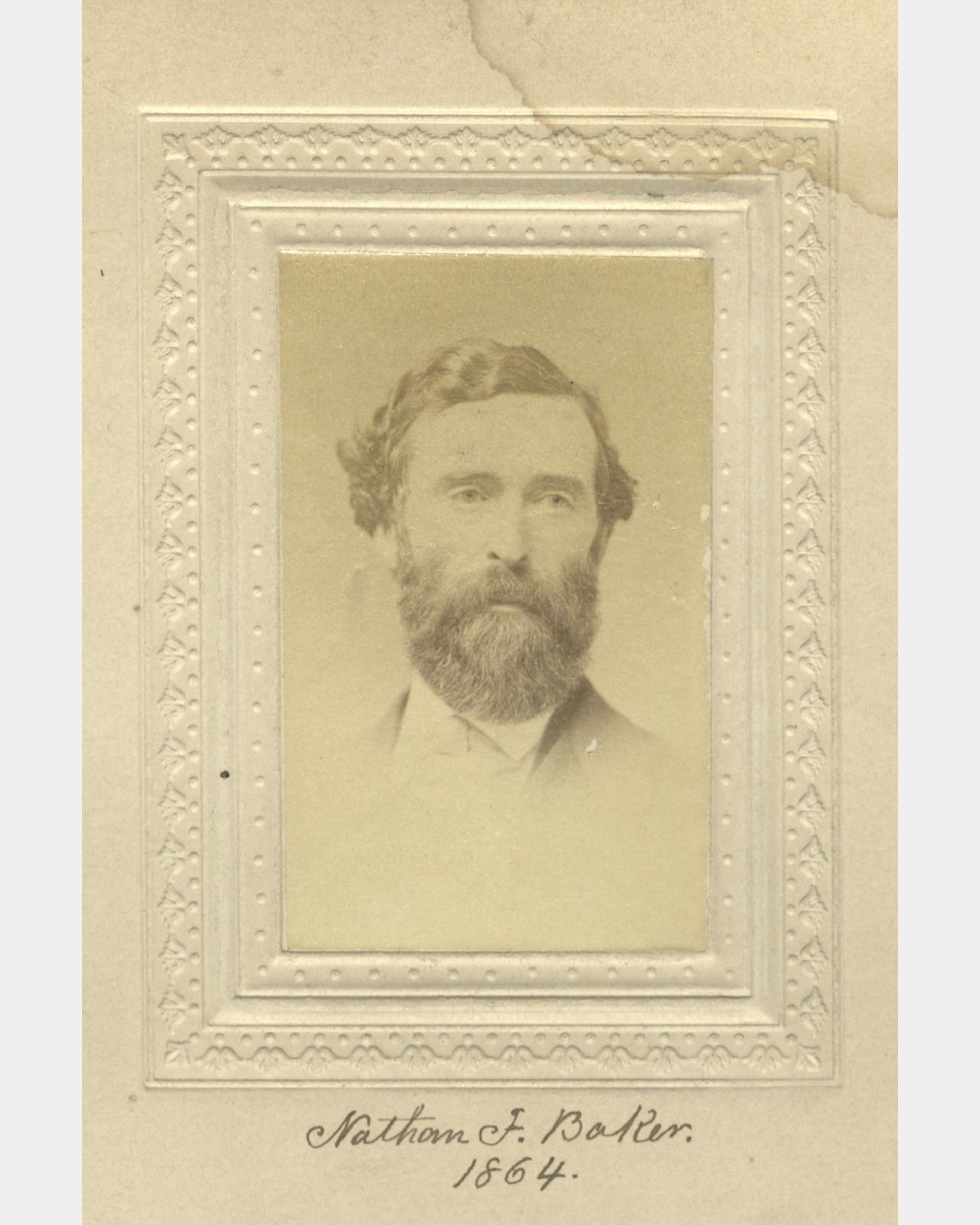 A sepia-colored photographic portrait of a man with a full beard