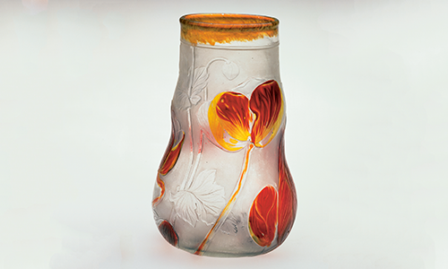 Clear glass vase with red flower decorations