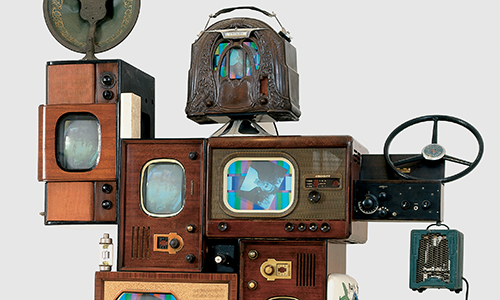 old televisions stacked together in a humanoid shape