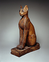 Figure of a Cat , 305 B.C.E. - 1st century C.E.. Wood (sycamore fig), gilded gesso, bronze, copper, pigment, rock crystal, glass, 26 3/8 x 7 1/4 x 19 in. (67 x 18.4 x 48.3 cm). Brooklyn Museum. Charles Edwin Wilbour Fund , 37.1945E