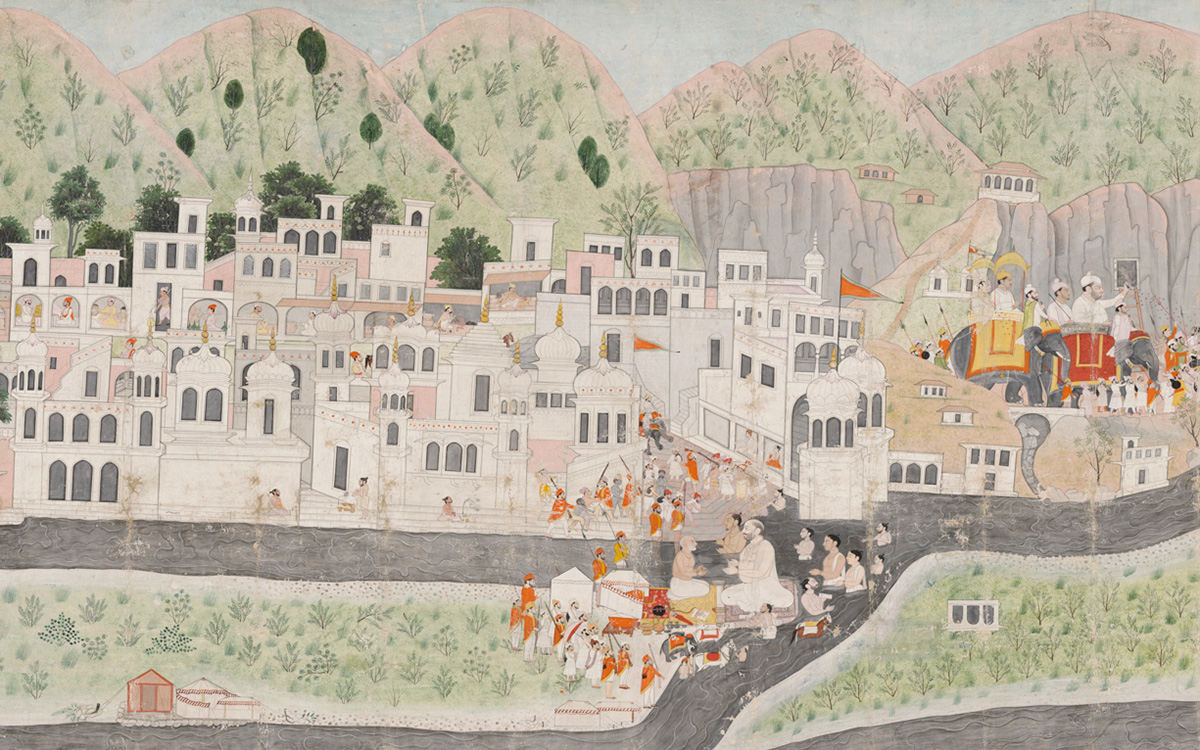 A town with white buildings set into a landscape with mountains in the background. Two groups of the people and an elephant are also shown.