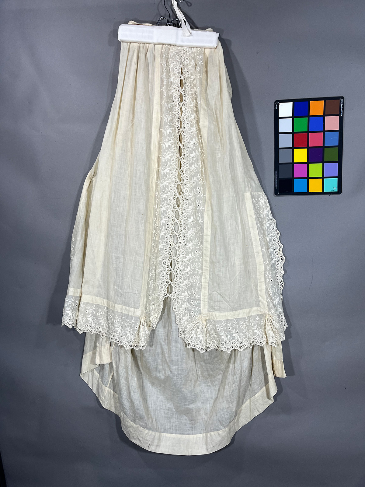 An intricate white skirt with yellowing