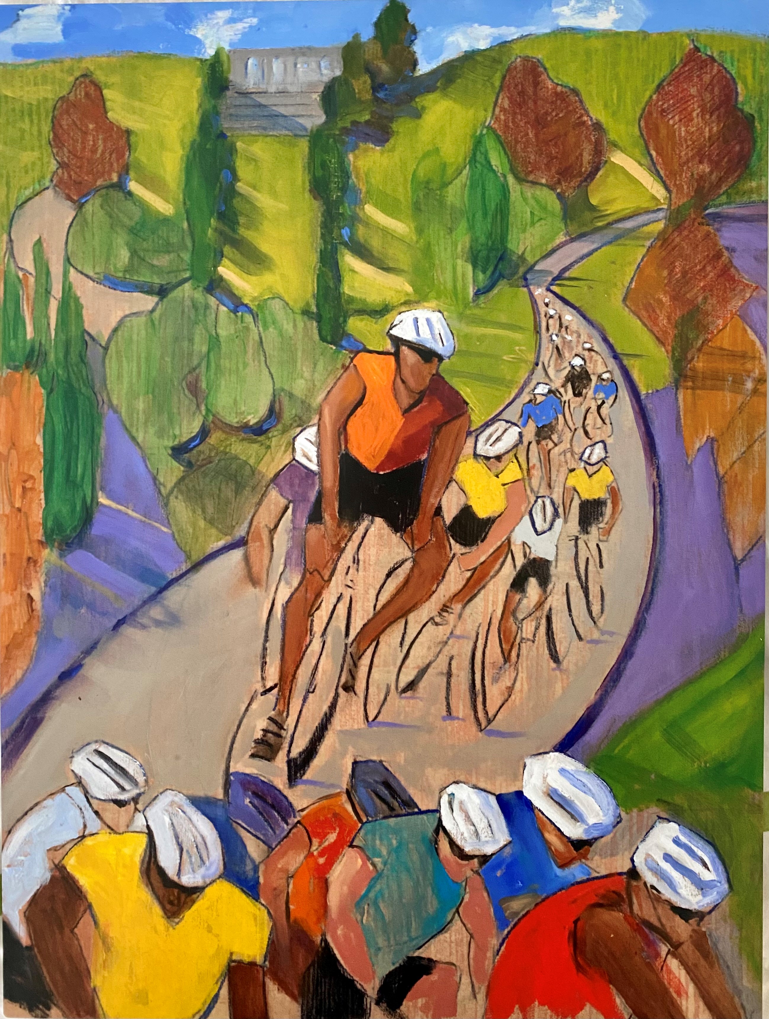 A group of 20 cyclists ride their bikes through a park under blue skies.