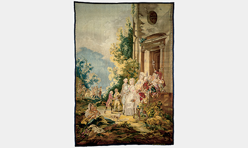 A tapestry featuring a royal scene outside a building