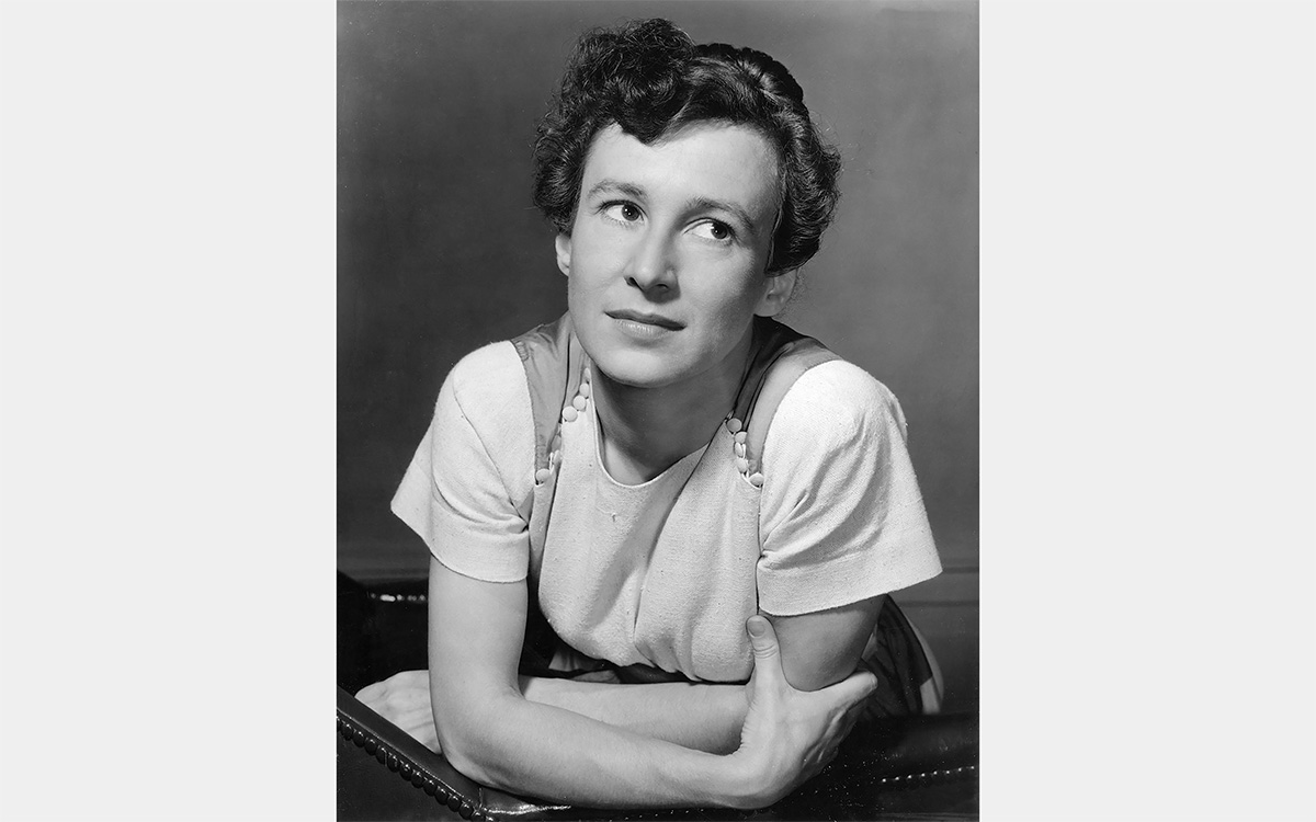 A black and white photo of a white woman with short brown hair