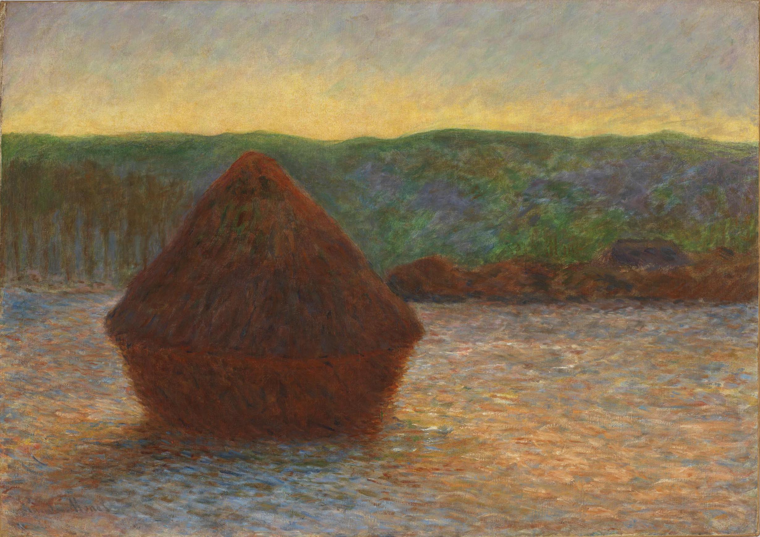A triangular haystack at sunset
