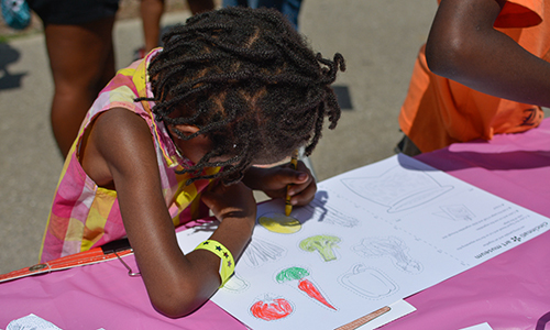 youth visitor working on a drawing
