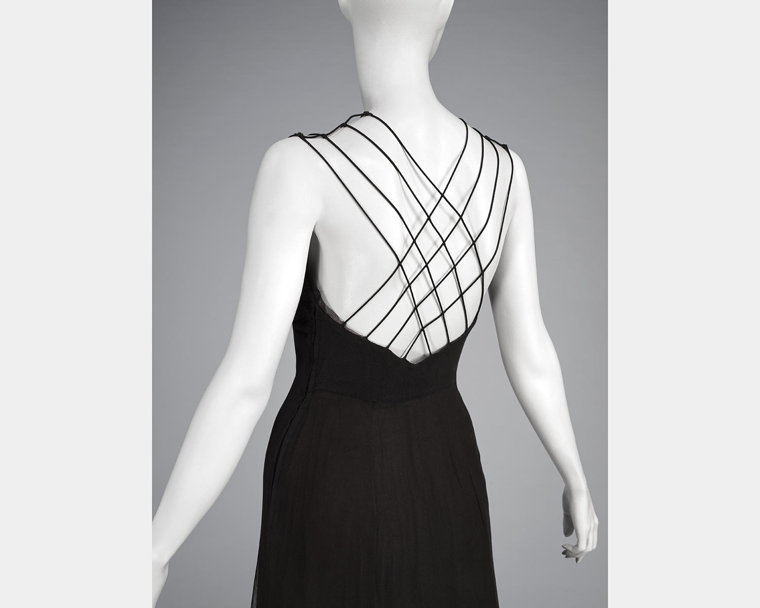 A black dress with open, spaghetti strap back