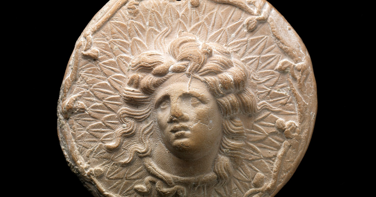 Miniature Votive Shield with Head of Alexander the Great as Gorgoneion, 3rd century BCE, Greece, moldmade terracotta, Cincinnati Art Museum, Museum Purchase: Lawrence Archer Wachs Fund, 2007.66