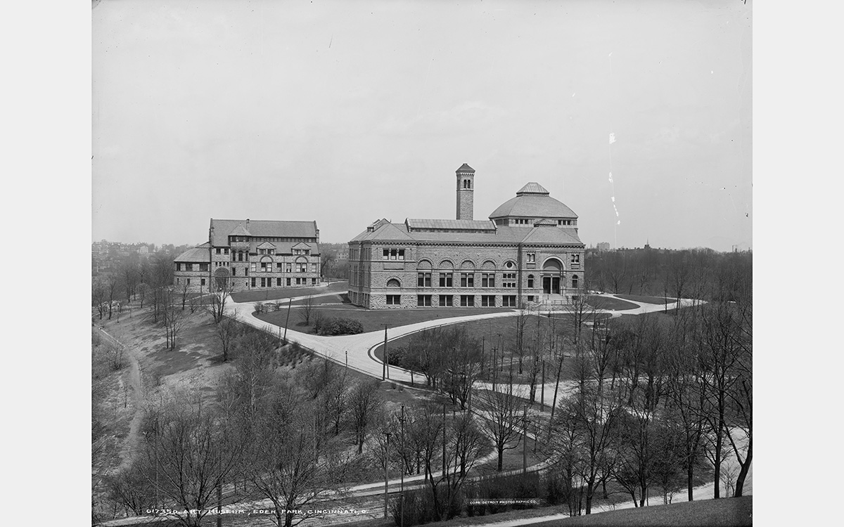 Black and white photo of two buildings on a hilltop surrounded by trees