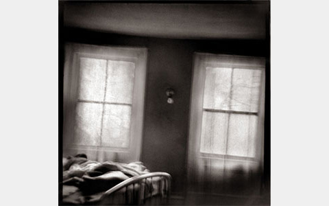 Nancy Rexroth's Two Windows, a black and white photograph of two windows in a bedroom