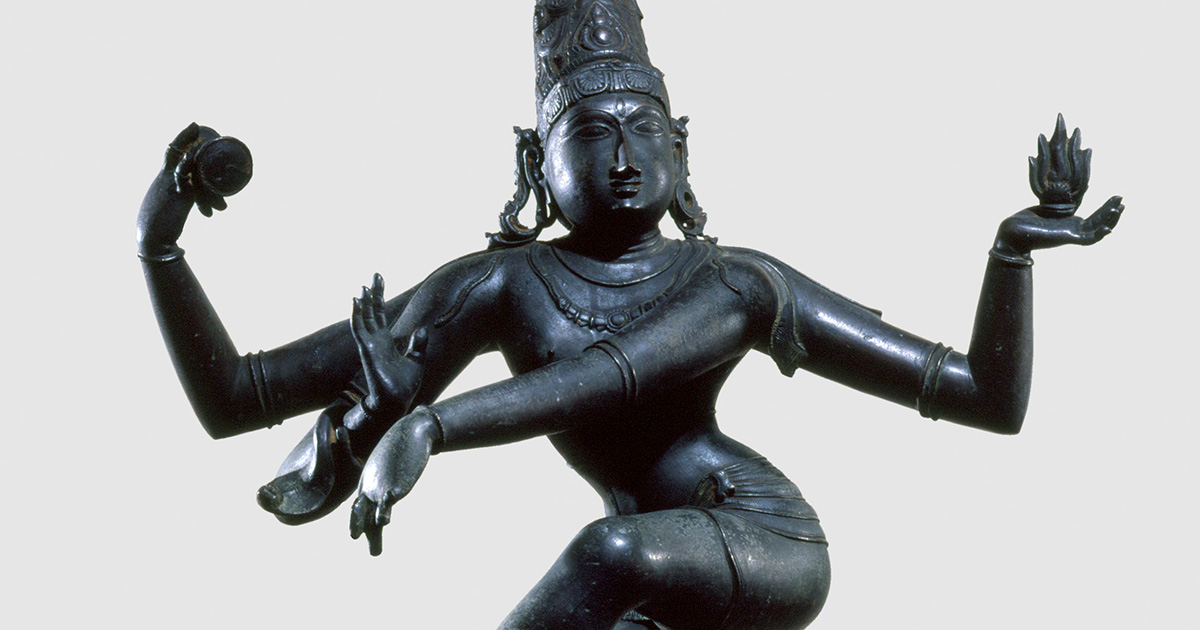 A black sculpture of Shiva dancing