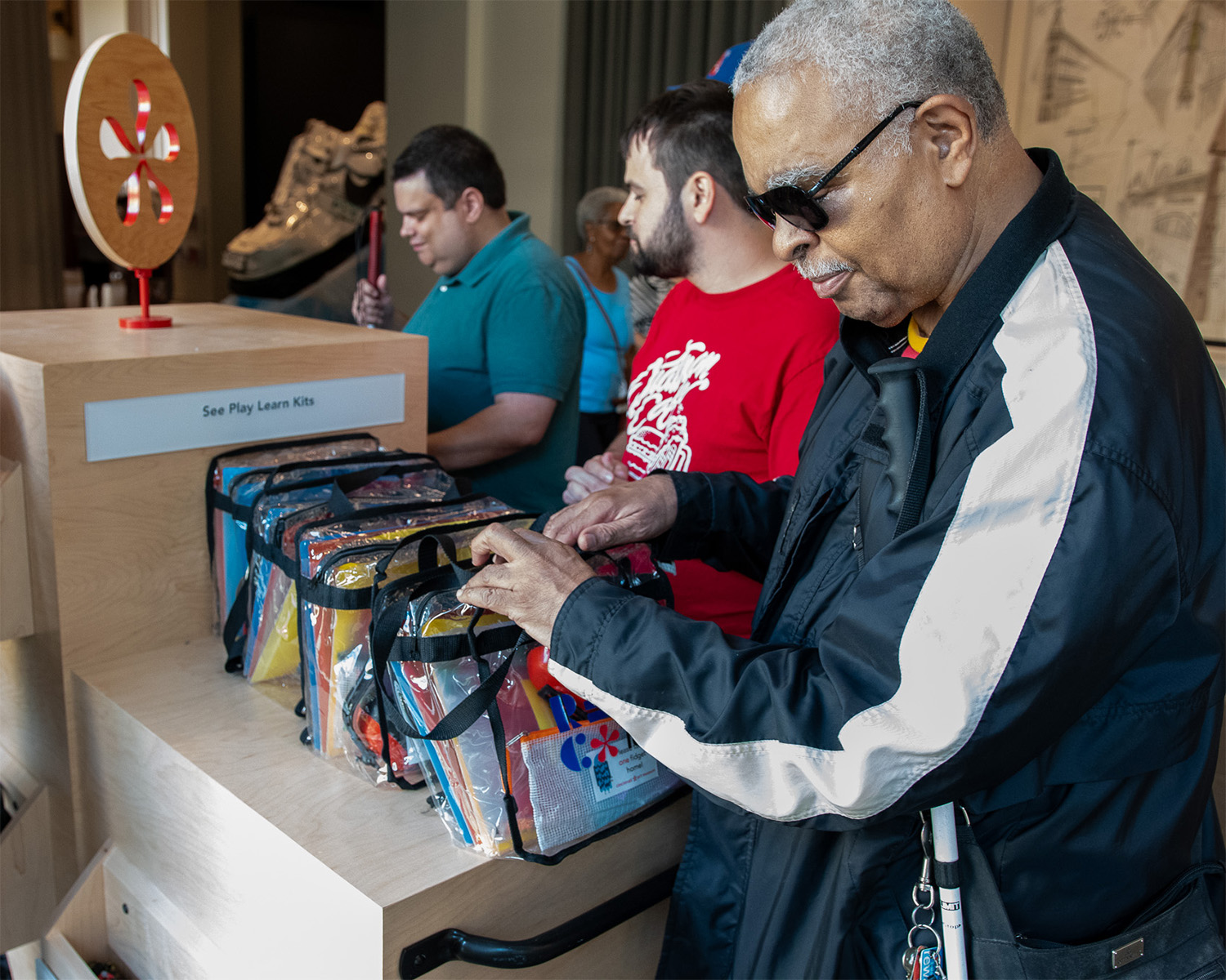 A Black man wearing sunglasses explores the Access Cart