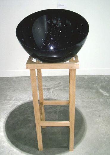 When Stars Came to Earth, from 2012, was made from blown and carved glass. The exterior is a solid black color, while the interior features tiny, carved white stars and constellations that create a miniature night sky.