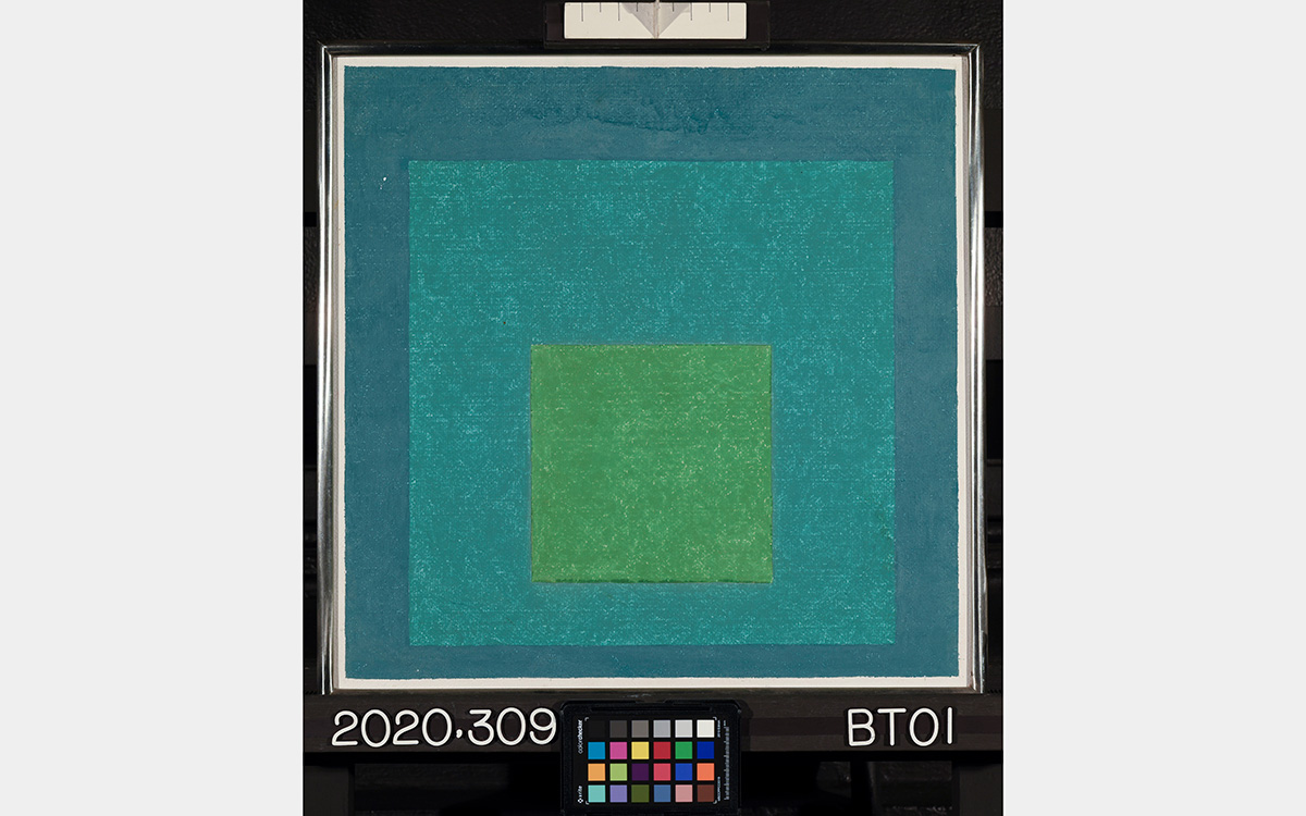 Square-shaped painting with three painted squares: blue square frames an aqua blue square which frames a green square.