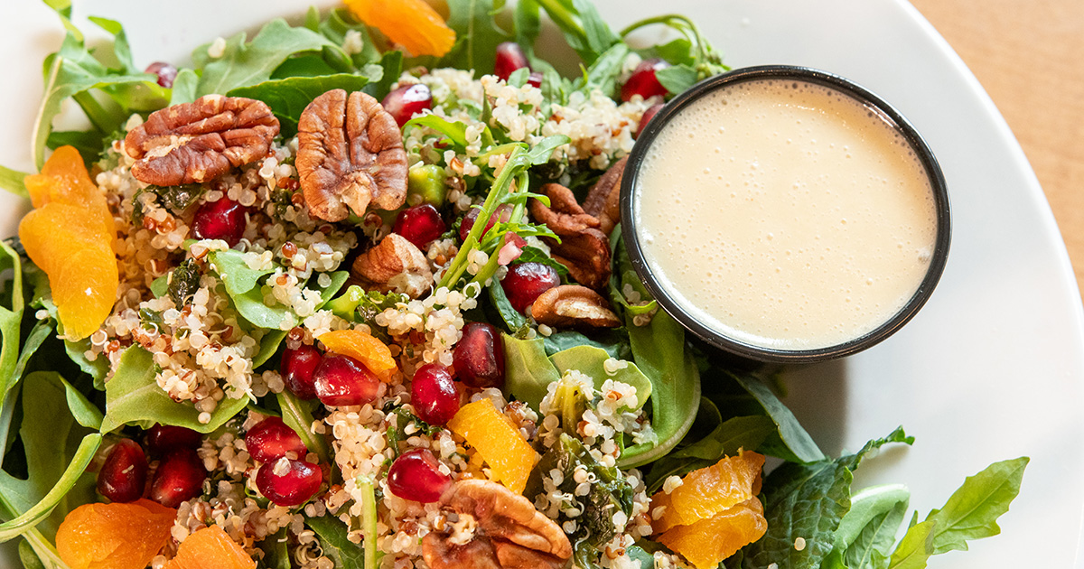 Detail image of the new Quiona Salad, featuring pomegranate, apricots and pecans
