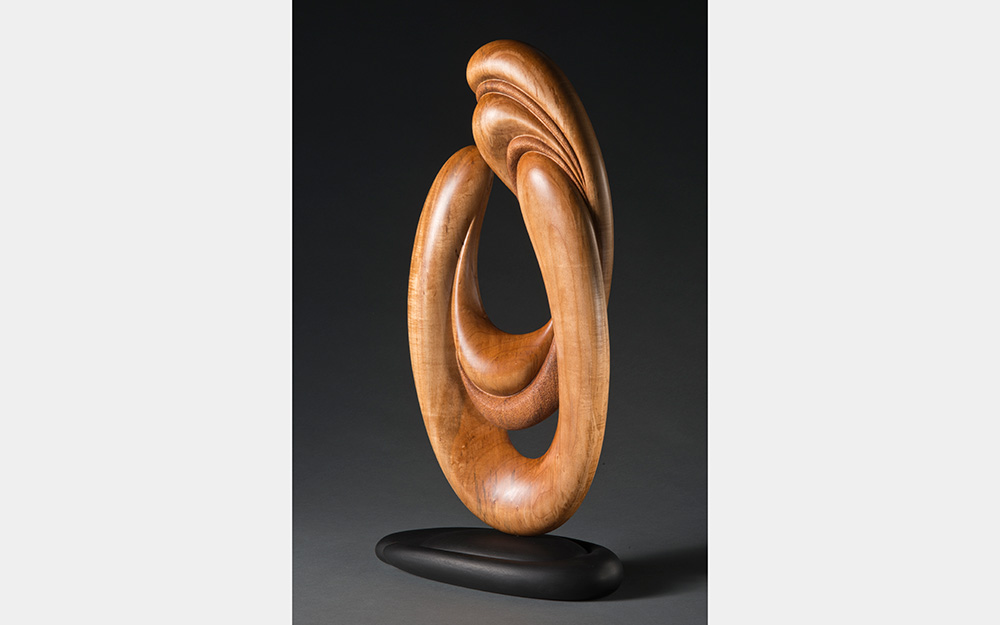 A curving, oval form made from warm wood