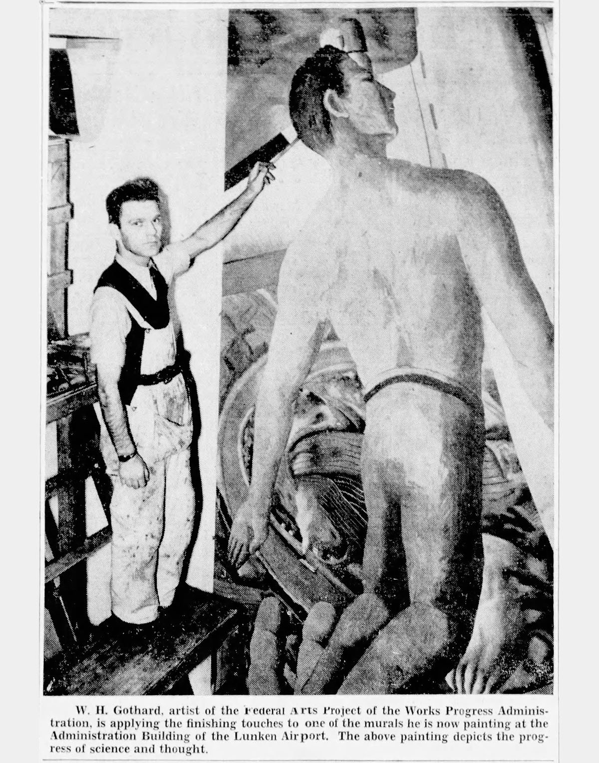 A black and white photo of a white man painting a large mural of a person