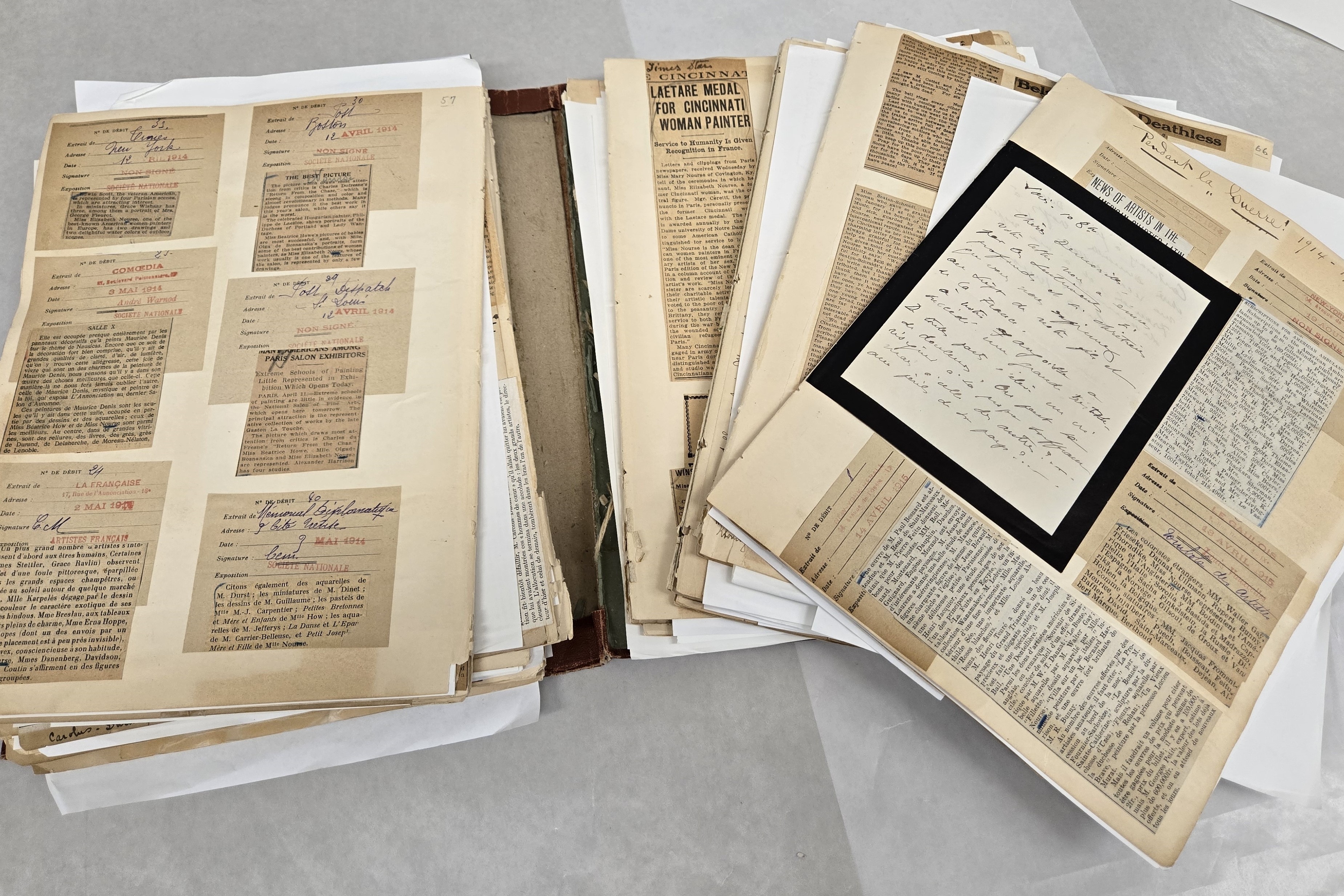 Open scrapbook with loose pages