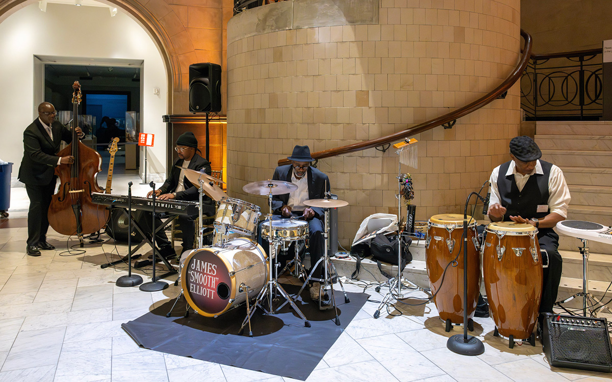 A band of Black people play in the Great Hall