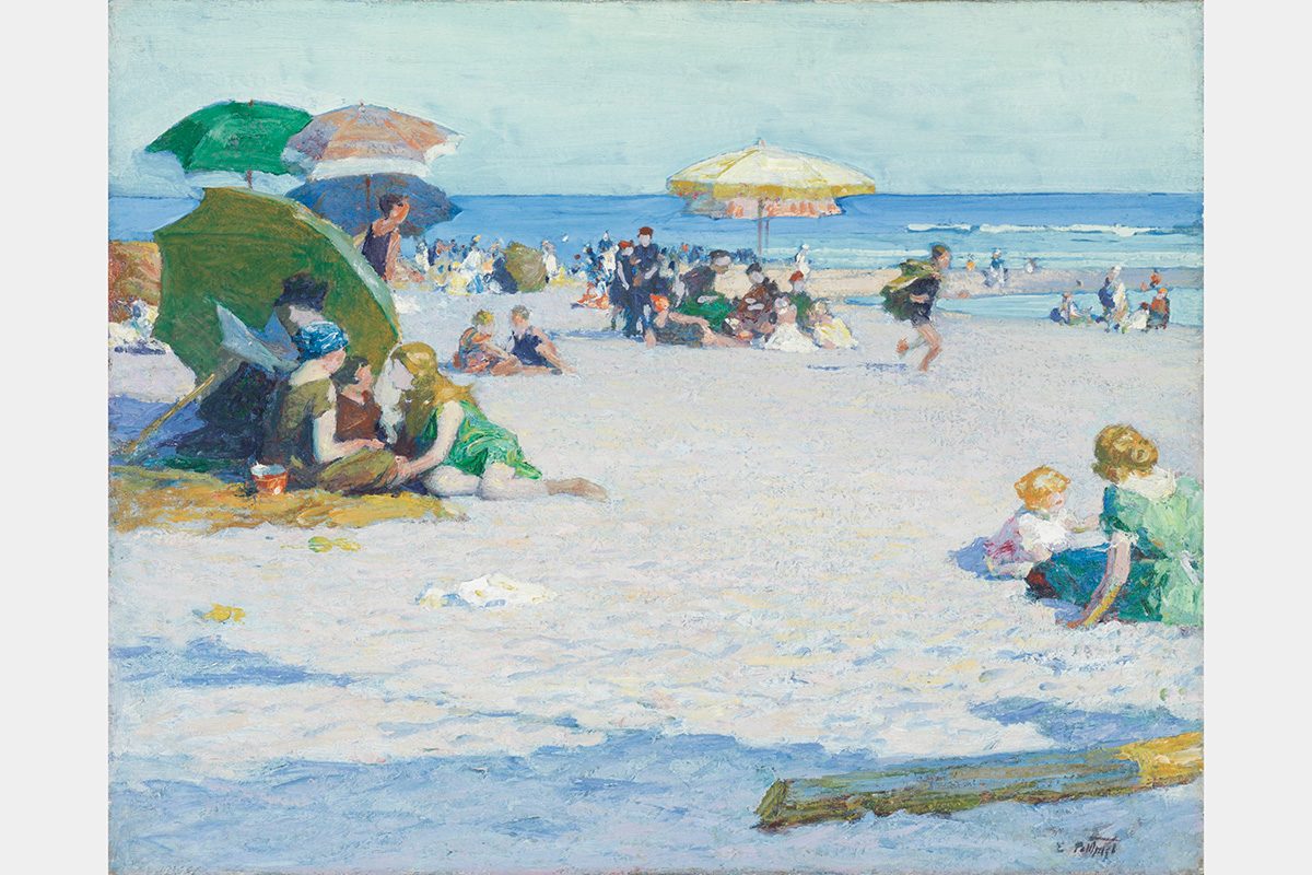 People on a sandy beach sitting under umbrellas with ocean and blue sky in the background.